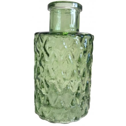   A green toned decorative bottle featuring a diamond ridged decal and small size 