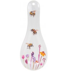  A smooth white plastic spoon rest with a beautifully printed Busy Bee Garden themed decal 