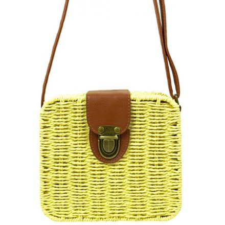   A beautiful little woven basket bag with an added rustic buckle feature and faux leather accents 