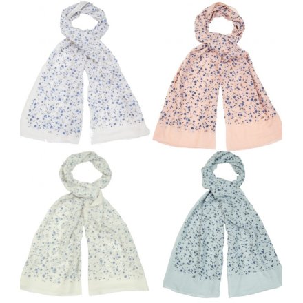 A delightful mix of floral inspired fabric scarves each set with its own tone and subtle sprinkle of glitter 