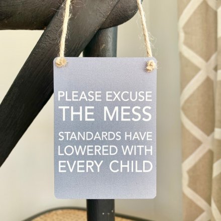 A mini metal sign featuring a grey toned base colour and added scripted text decal 