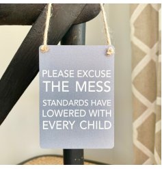 A mini metal sign featuring a grey toned base colour and added scripted text decal 