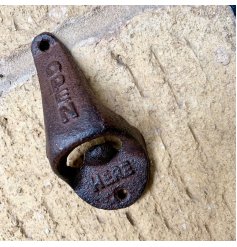 A distressed inspired Cast Iron Beer Bottle Opener with added embossed texts 