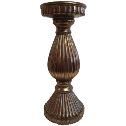  A large decorative Candle Holder set with a ribbed decal and distressed golden tone 
