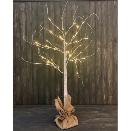 A birch bark inspired twig tree with warm glowing LED tips, perfectly placed within a hessian bagged base 