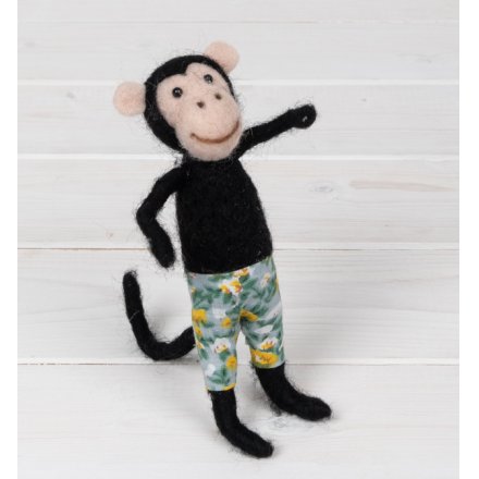 A wonderfully crafted and original felt monkey figurine with colourful Hawaiian shorts and a bendy tail.