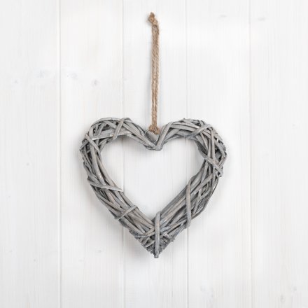 A natural rustic rattan heart decoration complete with a chunky rope hanger.
