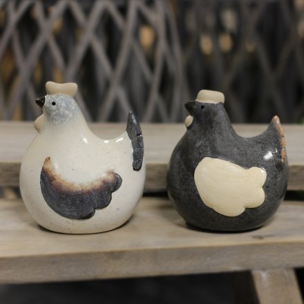 A mix of 2 terracotta chicken decorations with a rustic finish and grey/cream glaze.