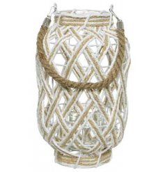 A chic white and natural woven lantern, complete with a chunky rope carry handle.