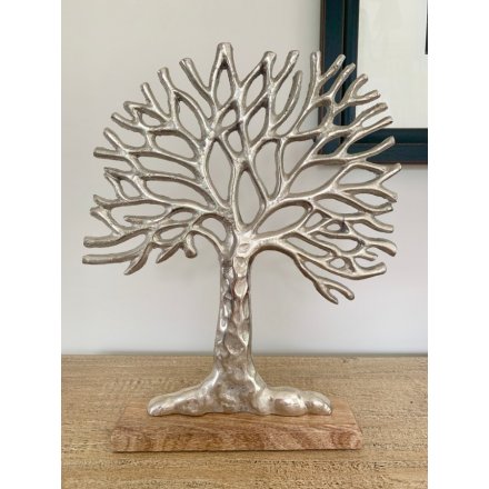 A gorgeously simple aluminium Tree of Life Ornament set upon a natural wooden block base 