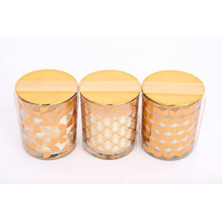  A stylish assortment of glass candle pots, each decorated with a trendy copper inspired geometric decal 