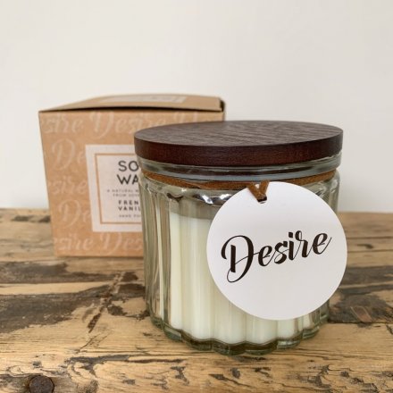  A traditional Vanilla scented soy wax candle, set within a ridged glass pot 