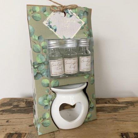   A pretty ceramic oil burner with a heart cut decal complete with additional essential oils 