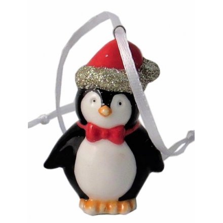 An adorable little hanging ceramic penguin complete with a glittery Santas Hat 