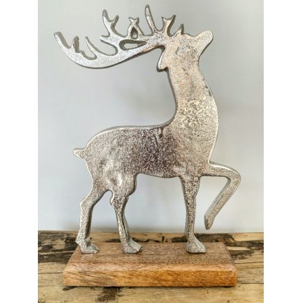Contemporary reindeer ornament - aluminium on a wooden base, small size is approx 29 cm tall
