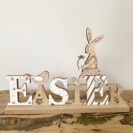 Wooden Easter sign with bunny and songbird decorations. Approx 23 cm long.
