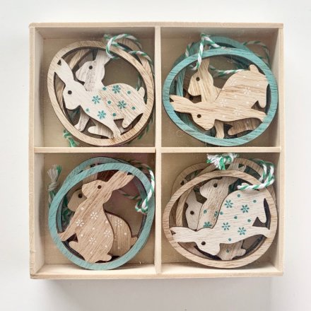 8 pack of sweet hanging wooden Easter ornaments of bunny inside egg with floral print decoration. Approx 6 cm tall