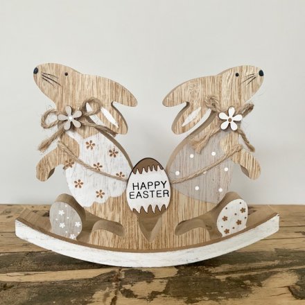 A charming rabbit rocker decoration with a Happy Easter egg sign. Key features include jute string bows and wood flowers