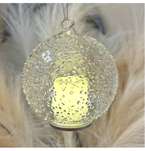 A stunning glass bauble which encases an LED candle. Complete with a cork stopper and organza ribbon.