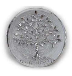  A gorgeously decorated plate featuring a silver Tree of Life embossment on the front 