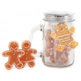 A festive scented assortment of Gingerbread shaped wax melts set in a clear glass mason jar 