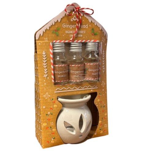 A festive scented set of essential oils and a white ceramic heart burner, set within a matching Gingerbread themed packa