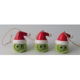 A ceramic brussel sprout hanging decoration set with a festive red hat