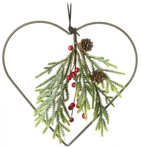 An attractive heart shaped wreath with a traditional festive foliage bunch including berries and pinecones