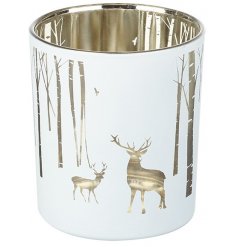 A beautiful white toned glass T-light holder with a silver internal tone and cute woodland scene