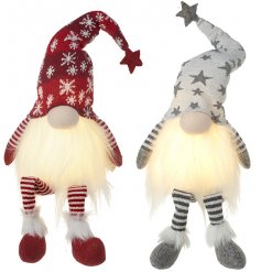An assortment of Nordic themed sitting gonks with magical warm glowing beads and high pointed hats 