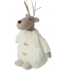 A plump little felt reindeer with a fuzzy woollen body and twig antlers 