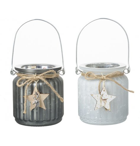 A mix of ridged glass candle pots set with grey and white mottled decals and both complete with a star and stag decal 