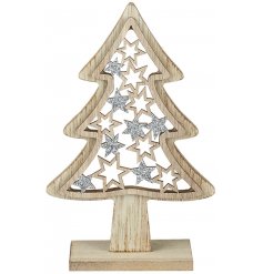 A simple standing wooden tree decoration with added stars and glittery finishes 