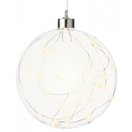 A simple hanging glass bauble filled with warm glowing LED lights 