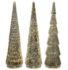 A sleek and stylish assortment of tall glass trees each set with a ridged decal and warm LED glow 