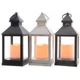 An assortment of 3 different coloured LED Lanterns with flickering candles in each 