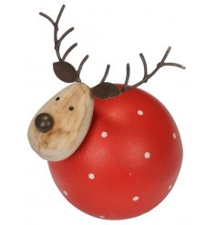 A round little red wooden reindeer with added polka dots 
