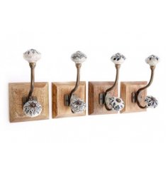 An assortment of natural based wall hooks with vintage inspired grey and black patterned ceramic knobs 