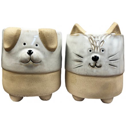  An assortment of small ceramic planters, each set with ears and feet and an added animal embossed decal 