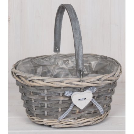  a small basket complete with a sturdy handle and sweet heart decal 