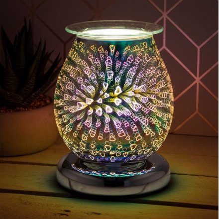 a glass lamp with oil burner/wax melt feature with dish, creating a 3-dimensional, multicoloured heart effect. 