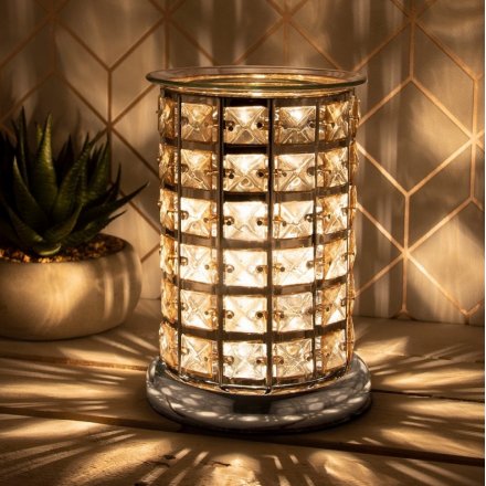  With its sparkly acrylic crystal surround and warm amber LED Glow, this chic lamp will be sure to place perfectly in an