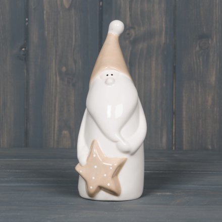  A smooth white ceramic Santa decoration with added beige accents and a star to finish 