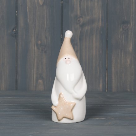   A smooth white ceramic Santa decoration with added beige accents and a star to finish 