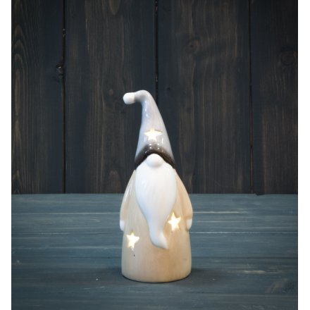  Filled with a warm glowing LED, this standing ceramic gonk has a soft grey and beige tone 