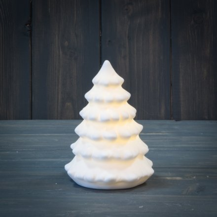 A simplistic Ceramic Tree ornament with an illuminating LED Centre display 