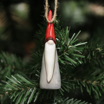 A small hanging ceramic gonk decoration set with a traditional festive red and grey tone and smooth glaze 