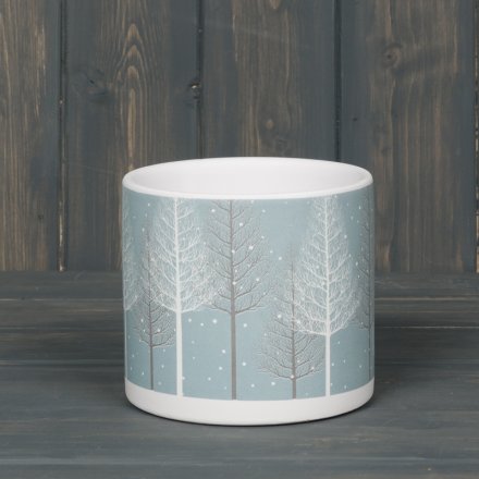 A large round planter pot beautifully decorated with a Winter Woodland scene 