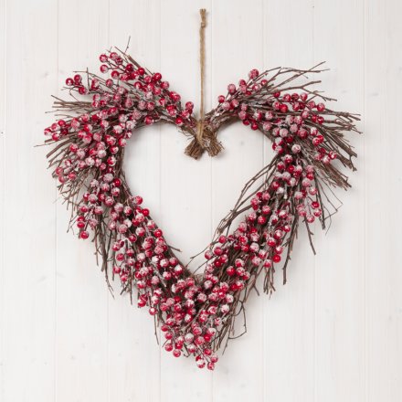  Covered with glitter frosted berries, this charmingly festive themed wreath will hang perfectly on any front door at Ch