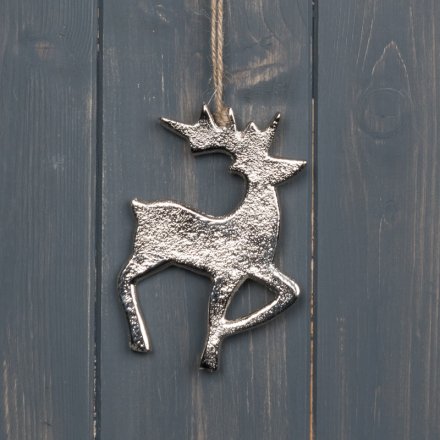 A hammered metal reindeer decoration with a sleek silver tone and jute string hanger 